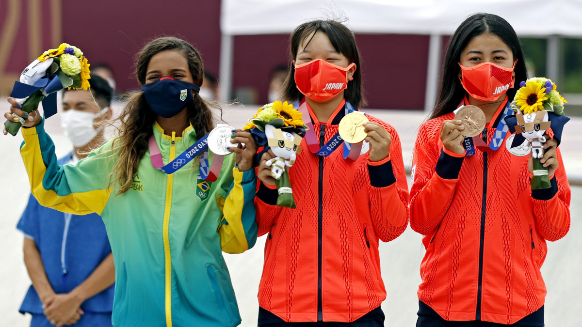 Rayssa Leal (BRA), silver; Momiji Nishiya (JPN), gold; and Funa Nakayama (JPN), bronze; celebrate with their medals in the women's street skateboard during the Tokyo 2020 Olympic Summer Games.